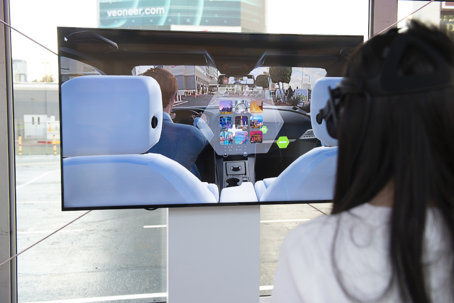 Woman trying a Valeo technology using VR at CES Las Vegas