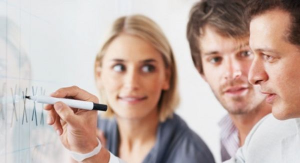 image of investors writing on a board