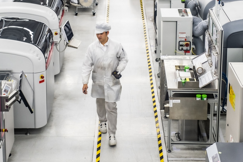 valeo employee walking in China plant