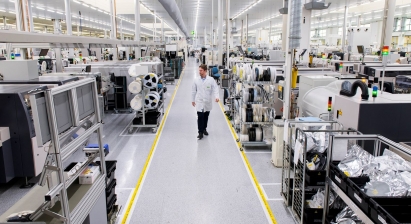 Person-walking-in-production-area-1_411x224_acf_cropped